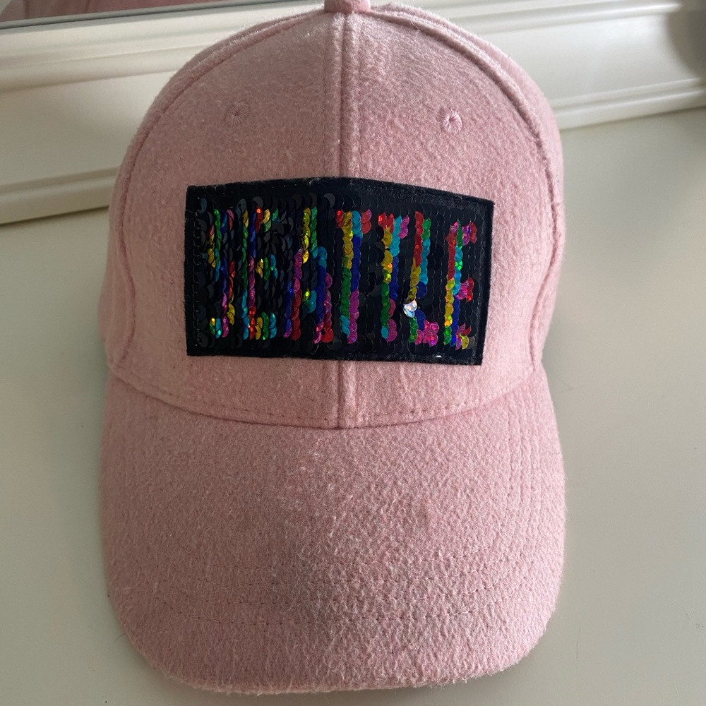 Baseball cap. Flip sequins. “Seattle”.
